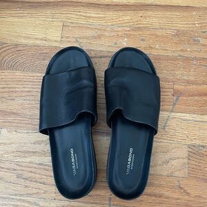 Vagabond black leather slides.